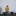 Person sitting alone outside on a bench in haze weather