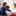 children sitting in front of an indoor fireplace