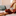 person with hand on their chest taking a deep breath